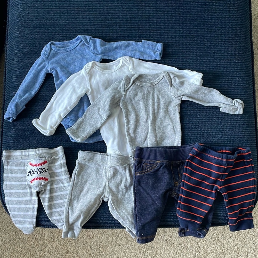 Carter’s Newborn bundle of 3 long sleeve onesies and 4 pants